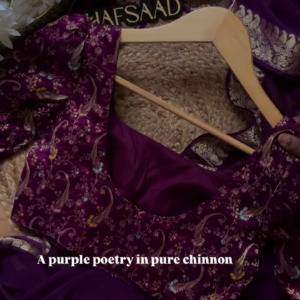 A pure chinnon purple jacquard and embroidery saree is a stunning choice for traditional and festive occasions
