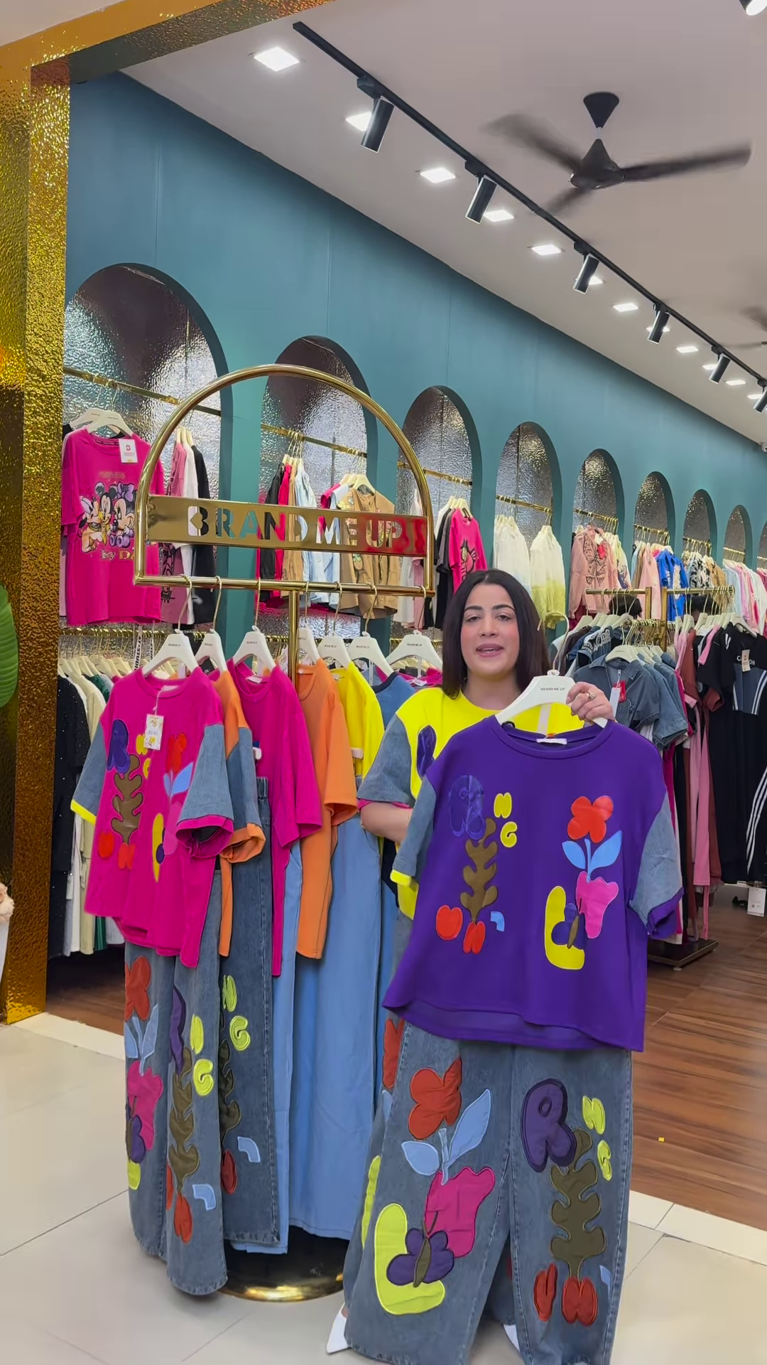 Multicolor Printed Ethnicwear Rack Display – Bold Floral & Abstract Garments in Boutique Interior with Teal-Gold Accents - Image 5